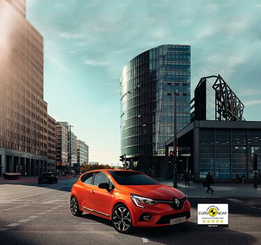 Clio coche pequeño exterior naranja